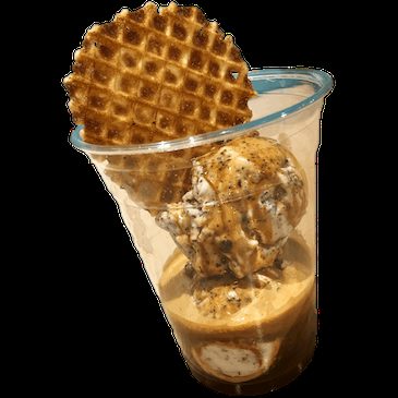 A clear cup of coffee-flavored gelato topped with a crispy waffle cookie and served with a blue spoon.