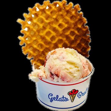 A scoop of strawberry gelato in a Gelato Brothers cup topped with a waffle cone.